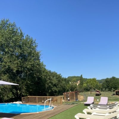 La Bergerie Gite private pool (with current system) and terrace with sun loungers and parasols
